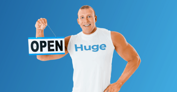 Huge holding an open for business sign